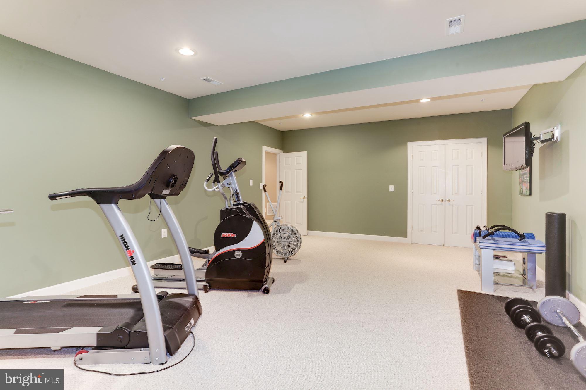9204 Jones Mill Road Chevy Chase, MD 20815 - Photo 39 of 50 a view of a room with gym equipment