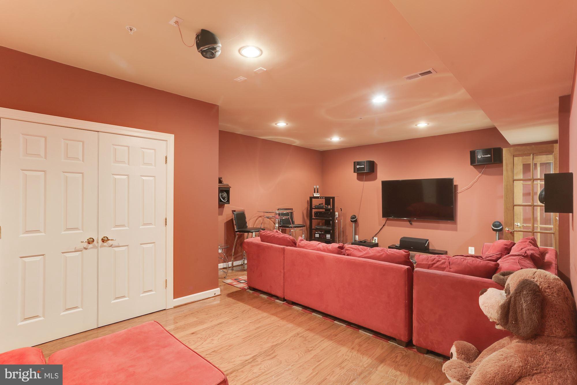 9204 Jones Mill Road Chevy Chase, MD 20815 - Photo 41 of 50 a living room with furniture and a flat screen tv