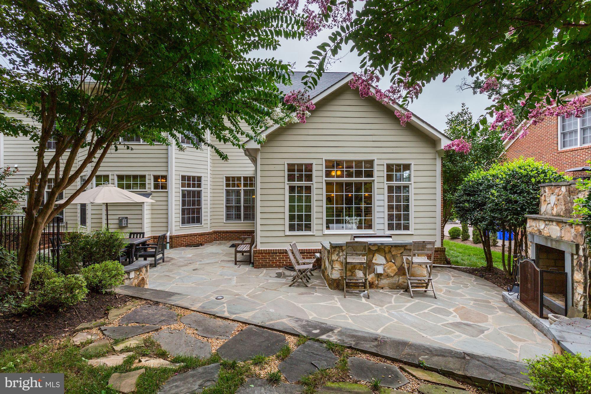 9204 Jones Mill Road Chevy Chase, MD 20815 - Photo 43 of 50 a front view of a house with outdoor seating