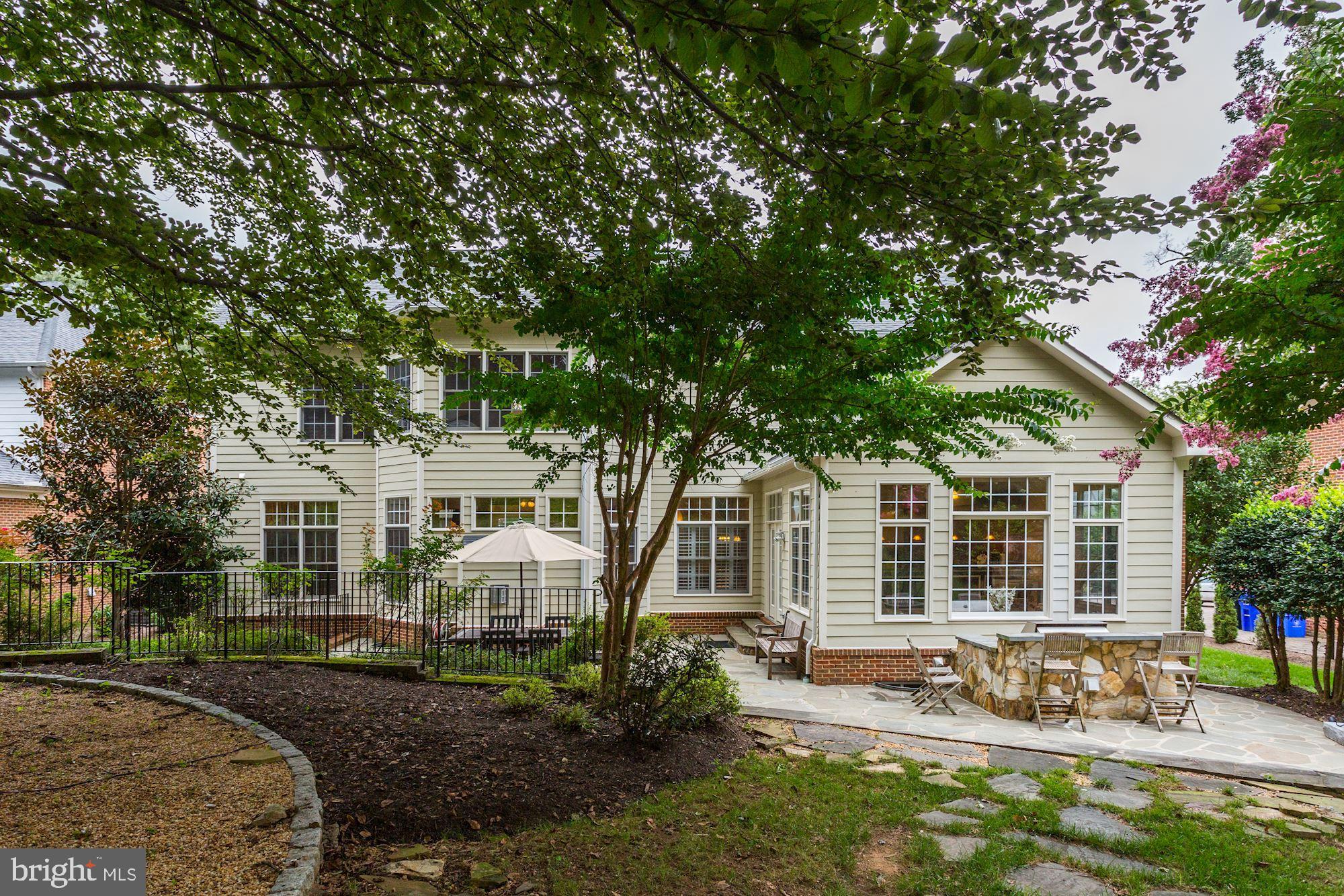 9204 Jones Mill Road Chevy Chase, MD 20815 - Photo 44 of 50 a front view of a house with yard tree and outdoor seating