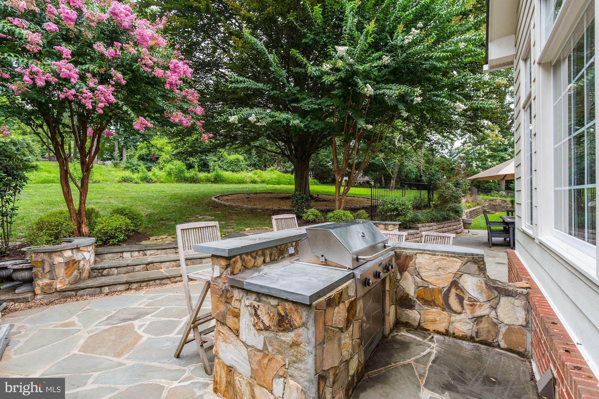 9204 Jones Mill Road Chevy Chase, MD 20815 - Photo 47 of 50 a view of a sitting area with swimming pool and garden