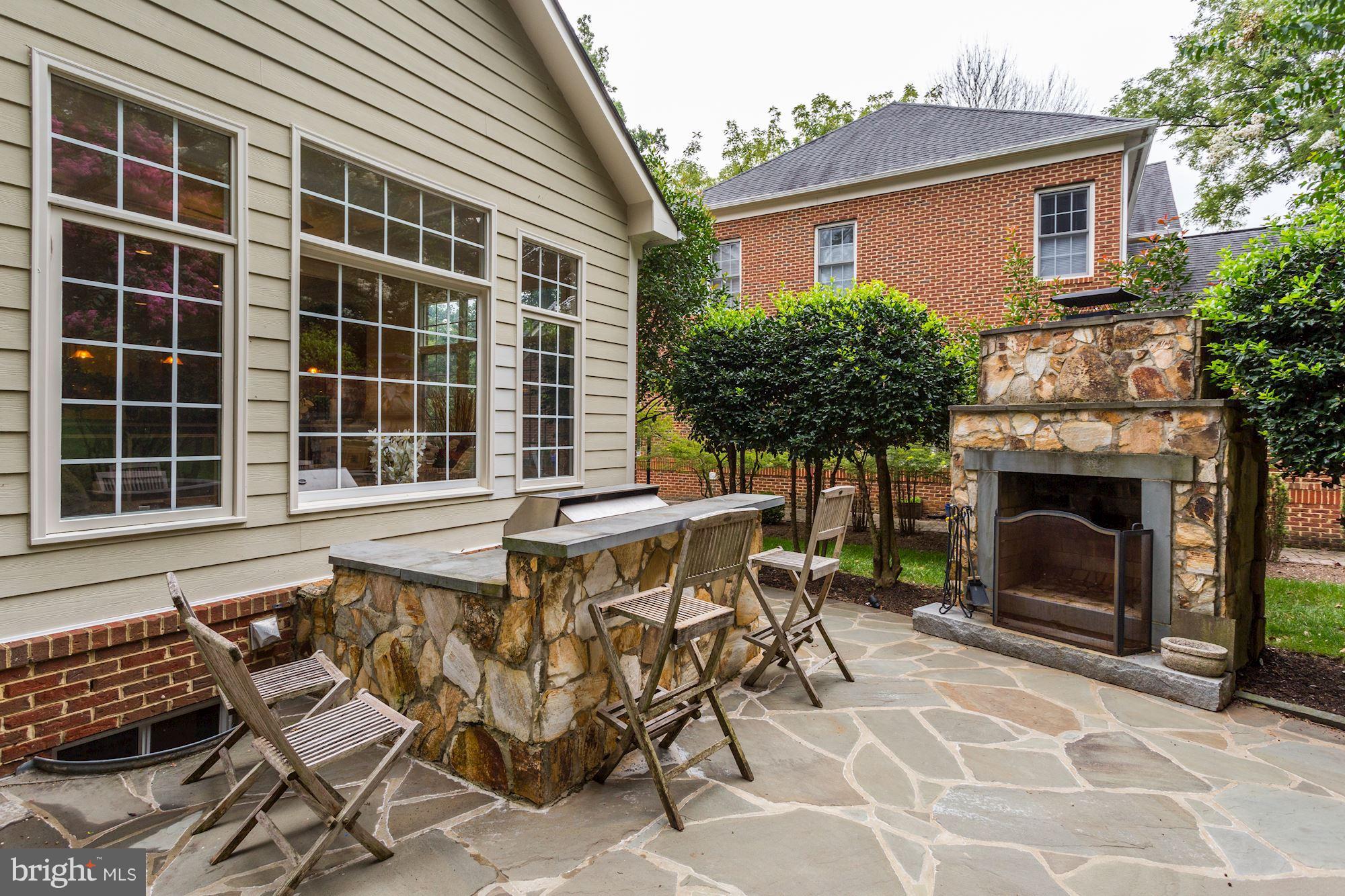9204 Jones Mill Road Chevy Chase, MD 20815 - Photo 48 of 50 a view of house with backyard and outdoor seating