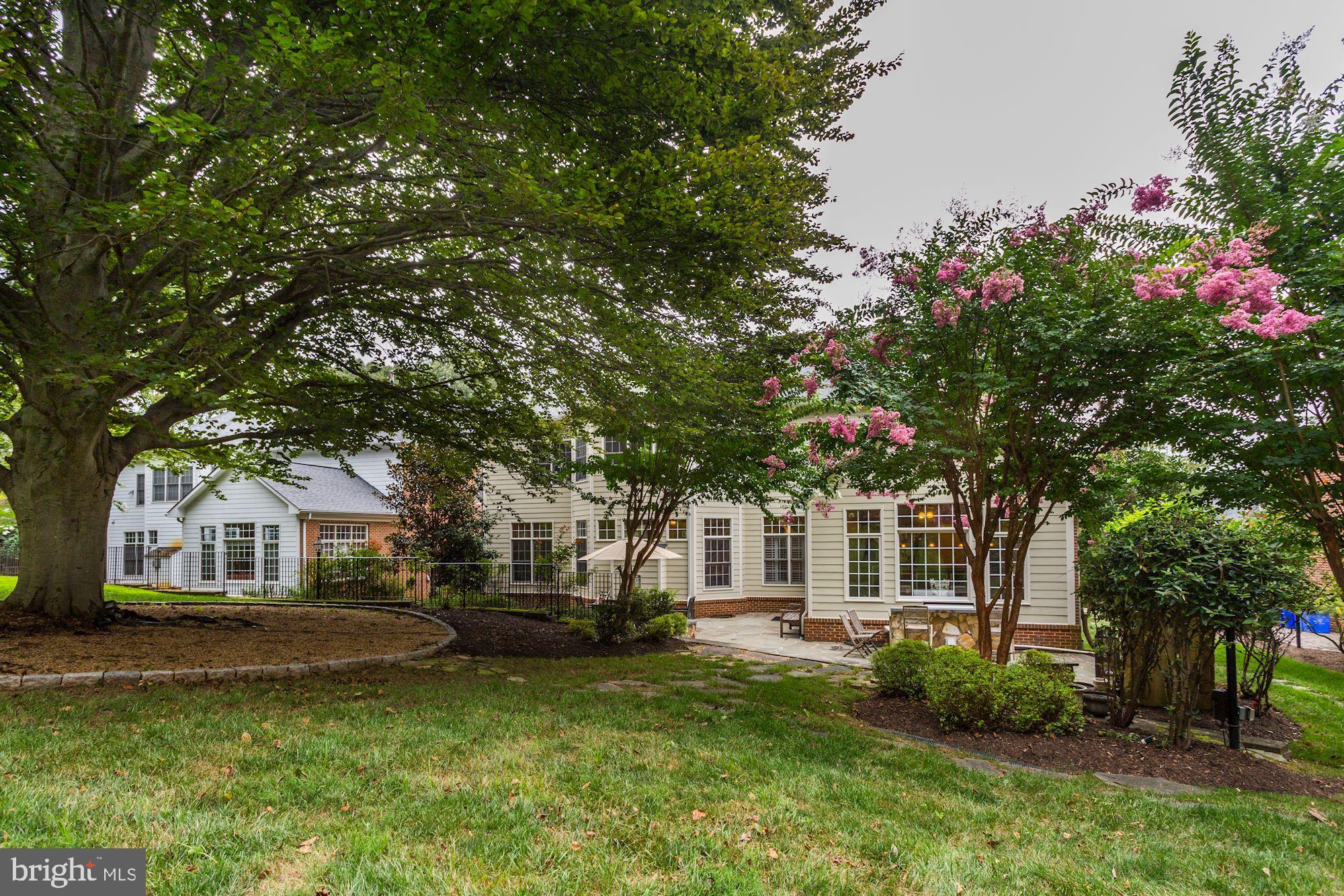9204 Jones Mill Road Chevy Chase, MD 20815 - Photo 49 of 50 a front view of a house with a garden