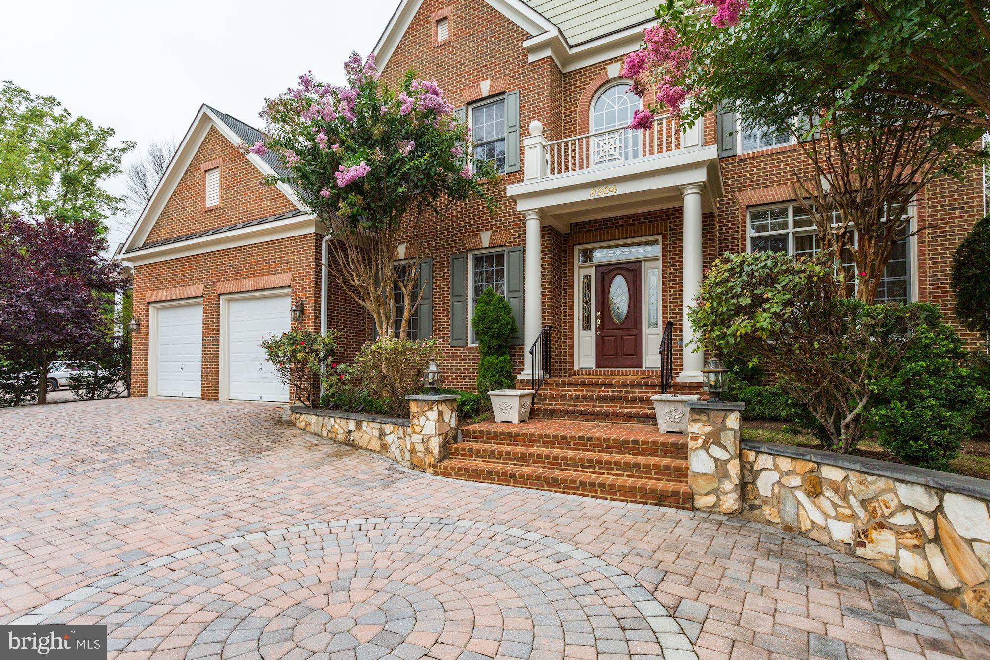 9204 Jones Mill Road Chevy Chase, MD 20815 - Photo 50 of 50 a view of a house with potted plants and a large tree
