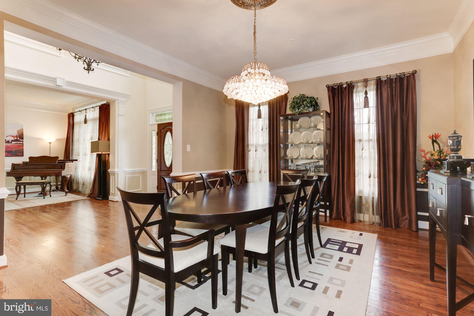 9204 Jones Mill Road Chevy Chase, MD 20815 - Photo 7 of 50 a view of a dining room with furniture window and wooden floor