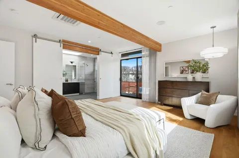 a bedroom with a bed and a couch