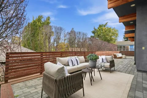 a view of balcony with outdoor seating and plants