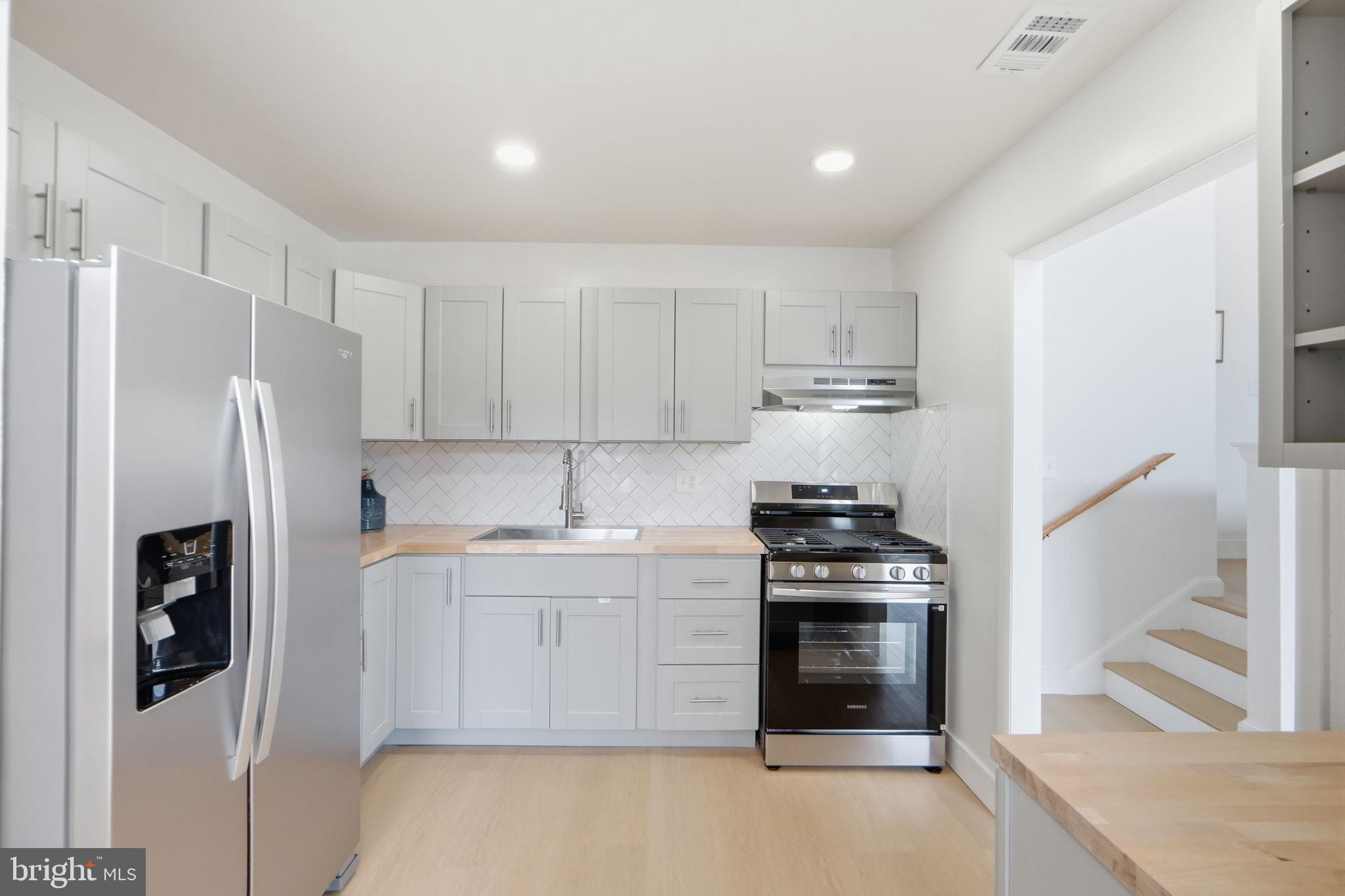 14427 Parkvale Road, Unit 7 Rockville, MD 20853 - Photo 12 of 43 Modern kitchen with sleek finishes.