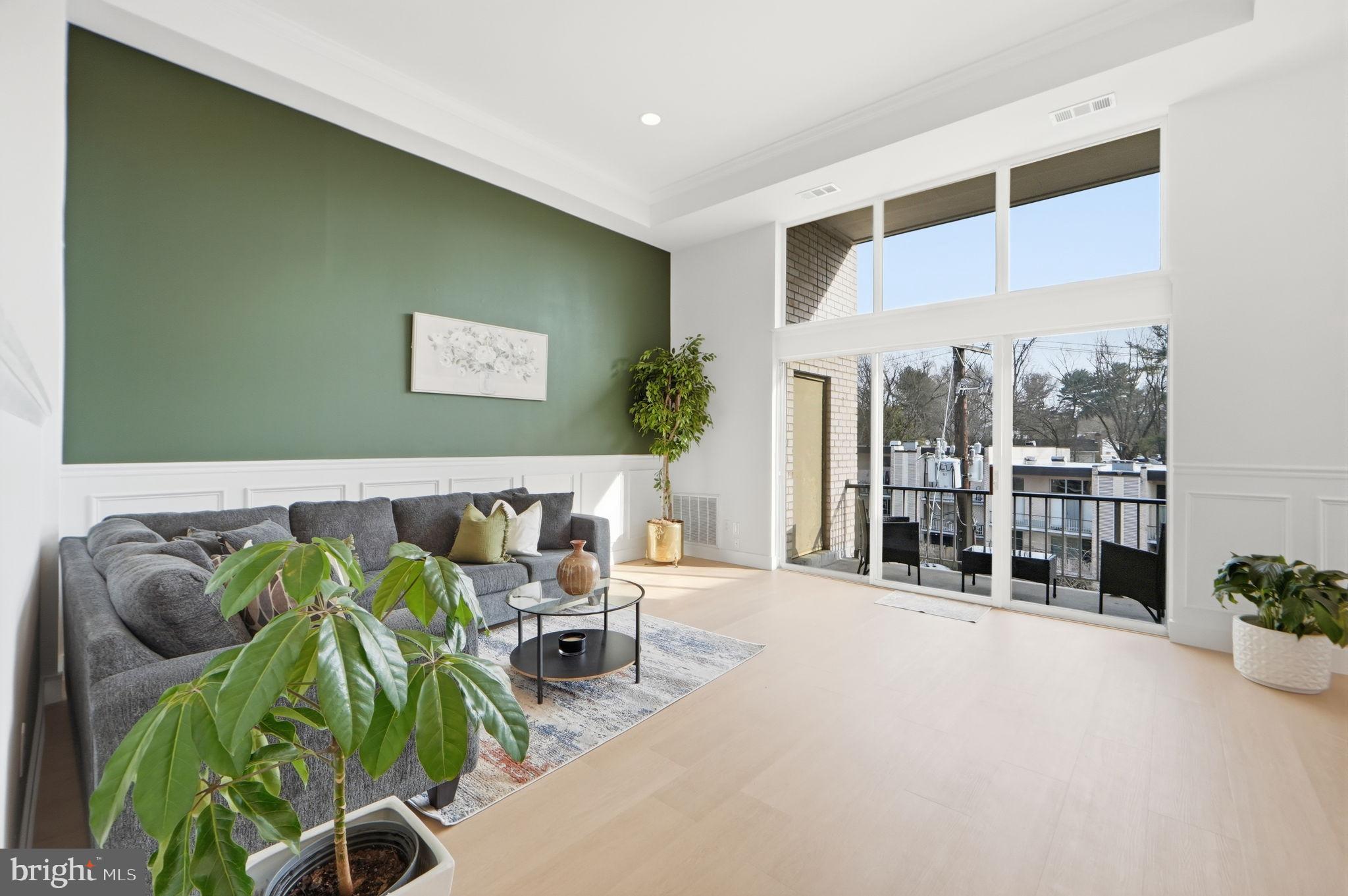 14427 Parkvale Road, Unit 7 Rockville, MD 20853 - Photo 2 of 43 Bright and airy living space with greenery.