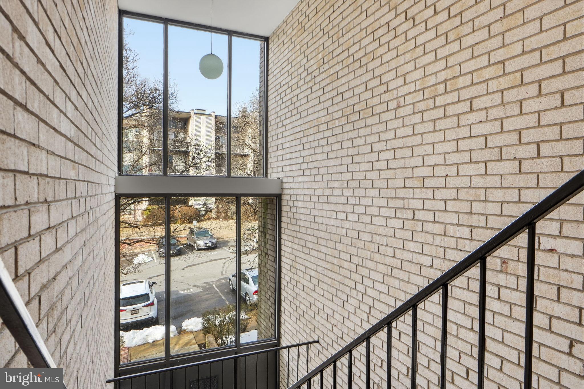 14427 Parkvale Road, Unit 7 Rockville, MD 20853 - Photo 31 of 43 Modern stairwell with natural light.