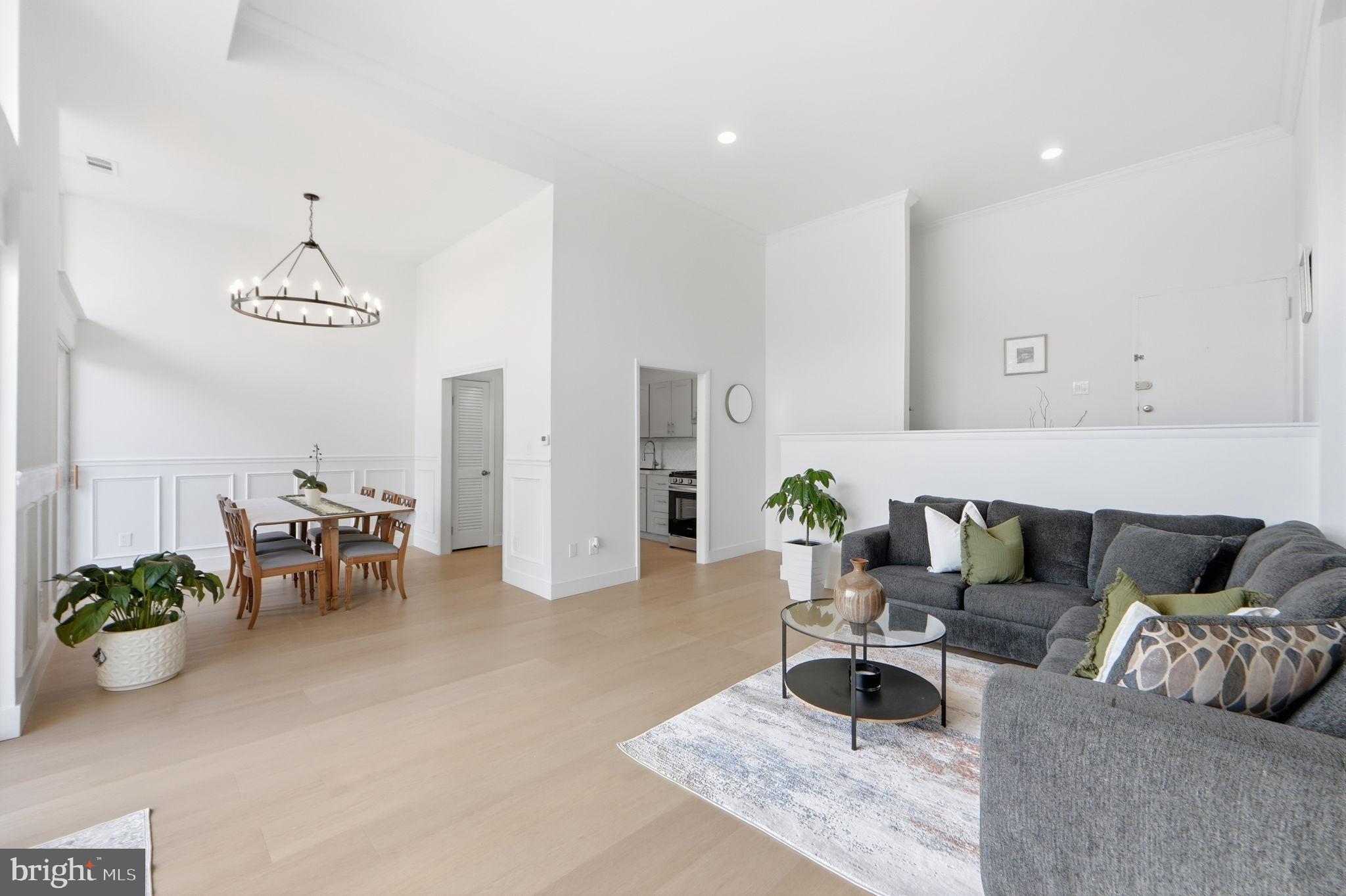 14427 Parkvale Road, Unit 7 Rockville, MD 20853 - Photo 6 of 43 Spacious modern living area with natural light.