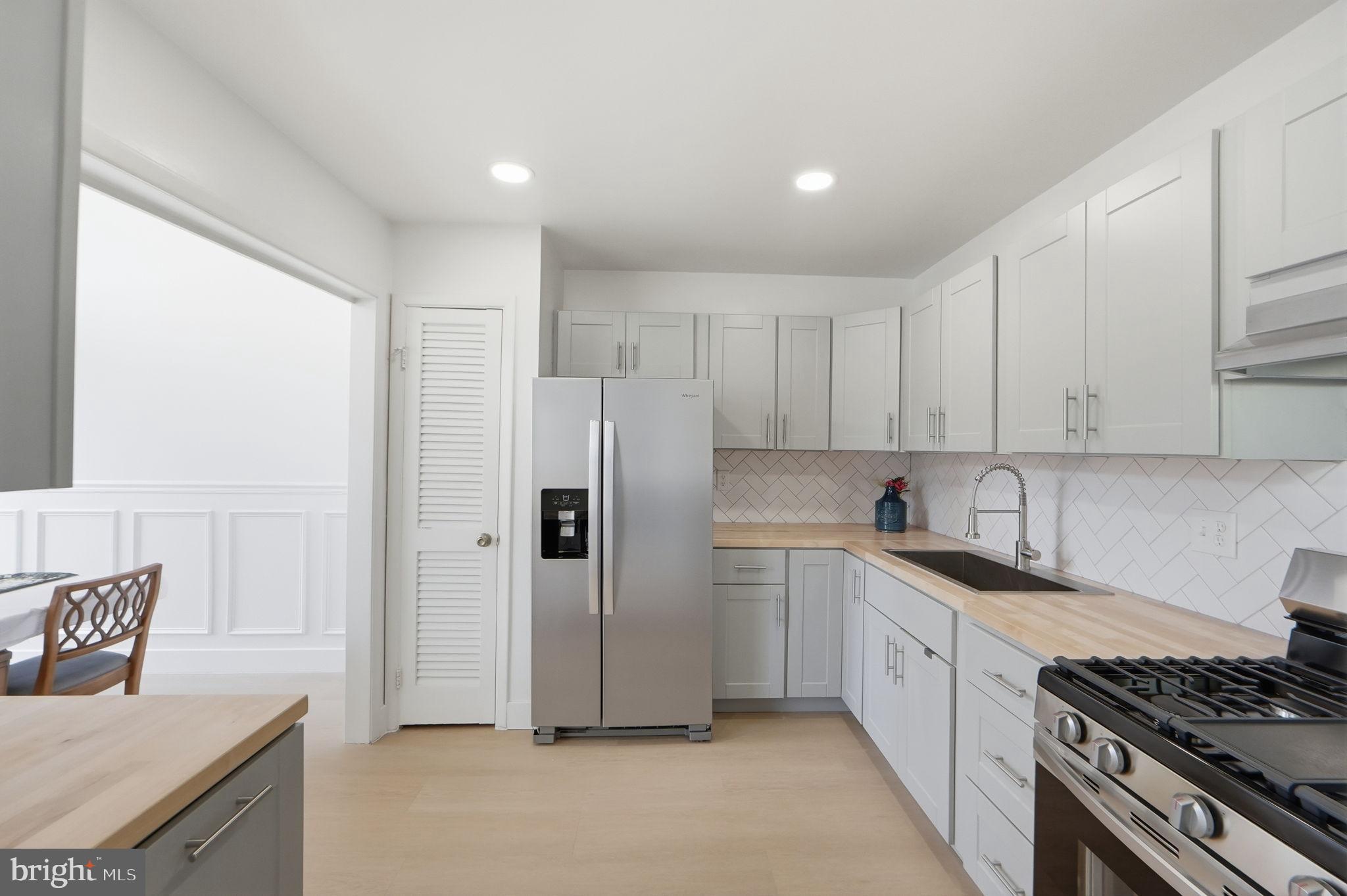 14427 Parkvale Road, Unit 7 Rockville, MD 20853 - Photo 10 of 43 Modern kitchen with sleek finishes.