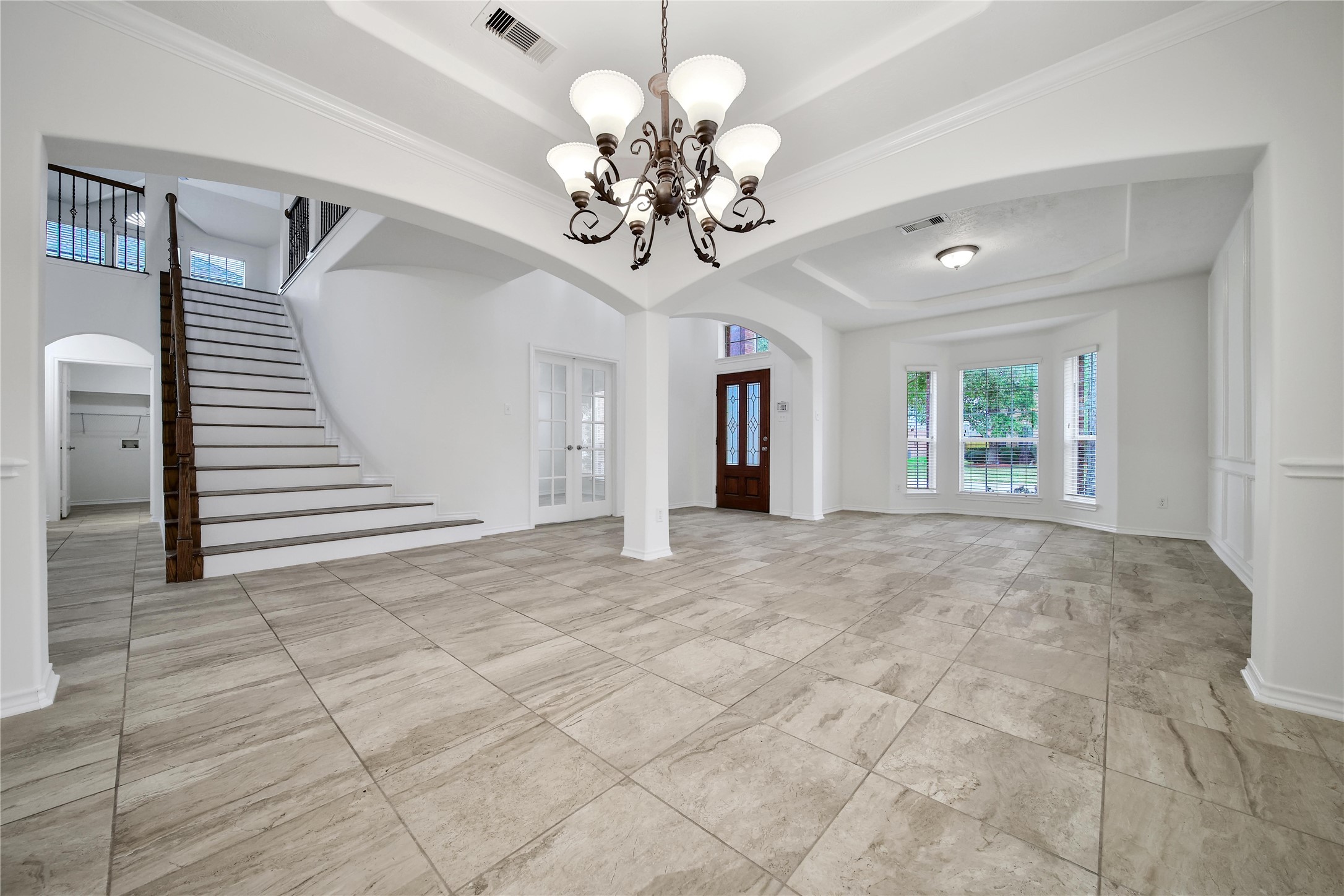 714 Stubbs Bend Drive Rosenberg, TX 77469 - Photo 12 of 42 a view of an empty room with a chandelier