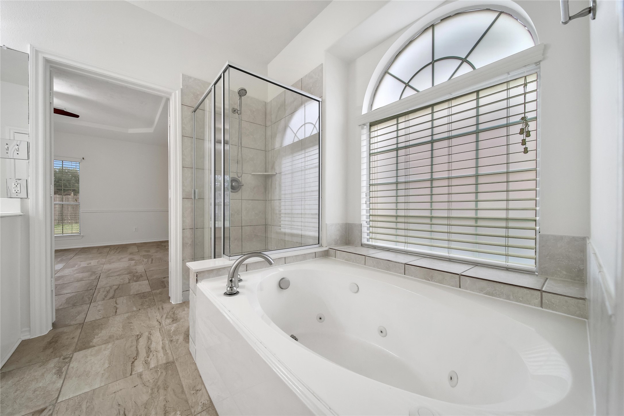 714 Stubbs Bend Drive Rosenberg, TX 77469 - Photo 34 of 42 a bathroom with a bathtub and a shower