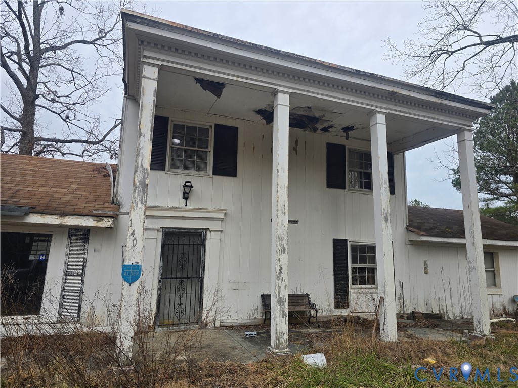 1402 Lewis Level Road Tappahannock, VA 22560 - Photo 9 of 14 a view of a house with a yard