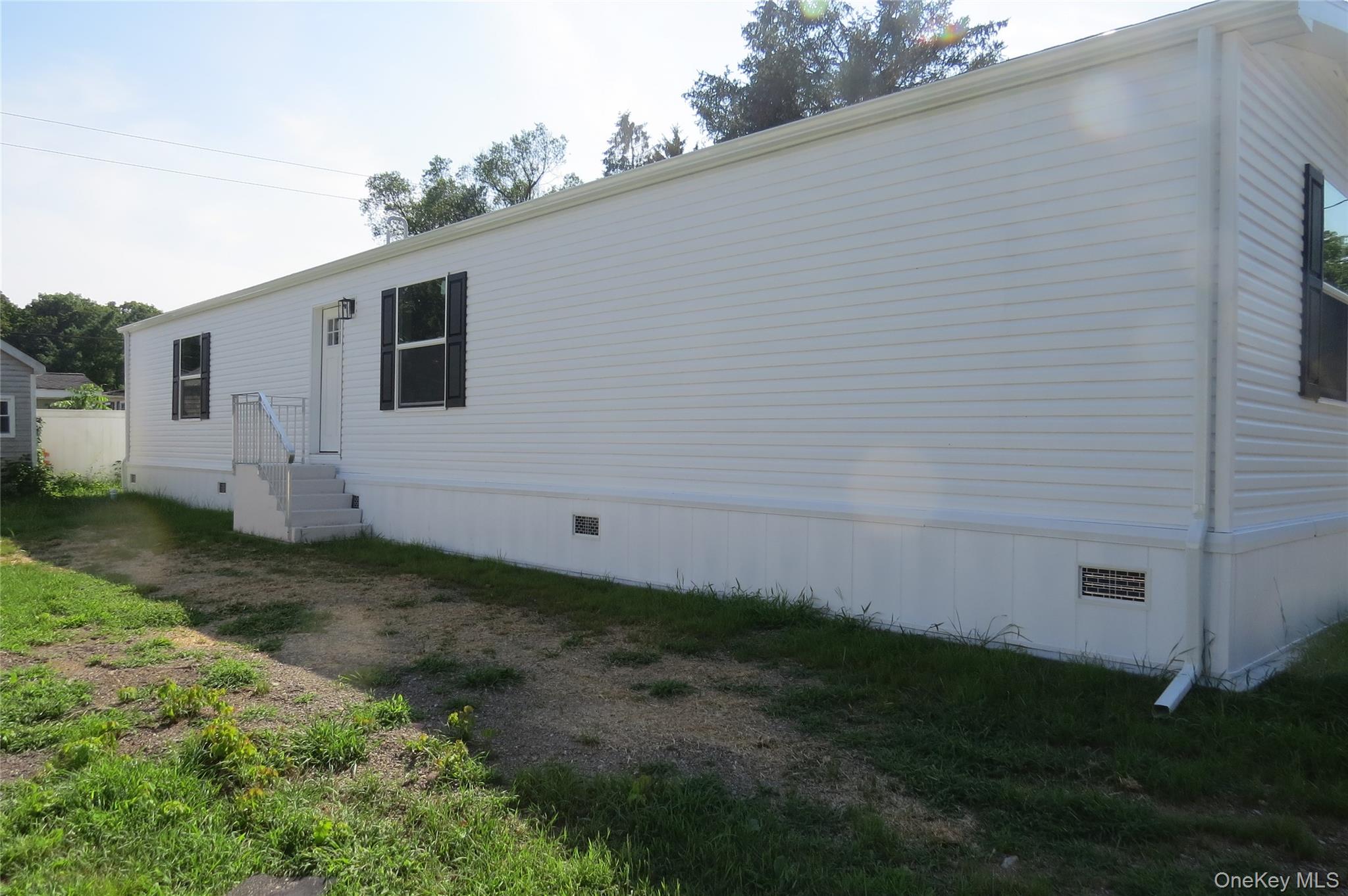 723 Beekman Road, Unit 35 Hopewell Junction, NY 12533 - Photo 2 of 16 a backyard of a house