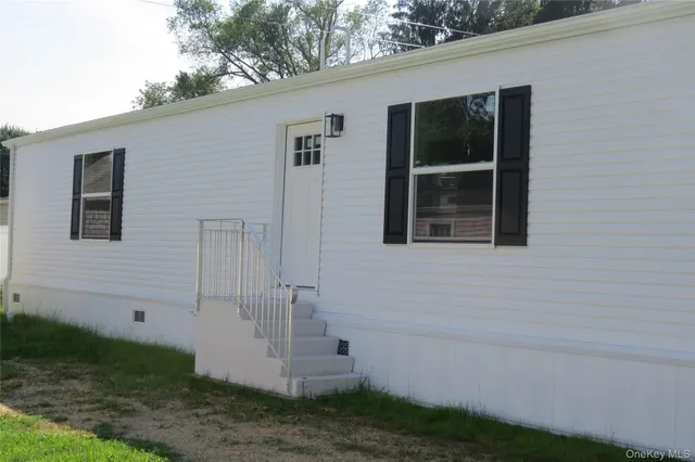 a view of front door and yard