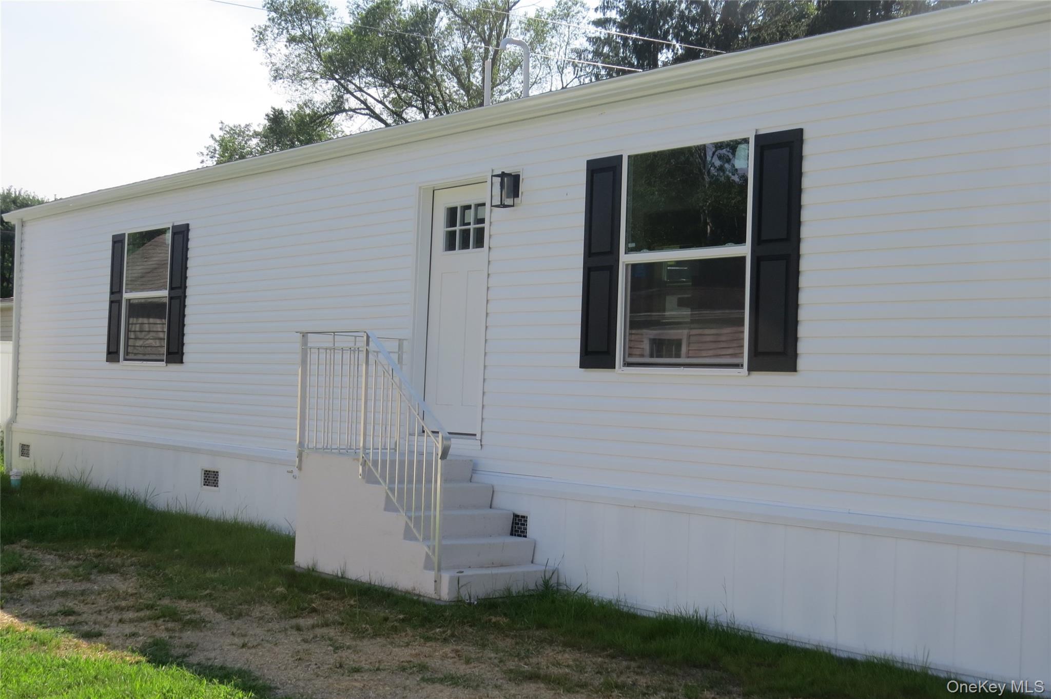 723 Beekman Road, Unit 35 Hopewell Junction, NY 12533 - Photo 3 of 16 a view of front door and yard