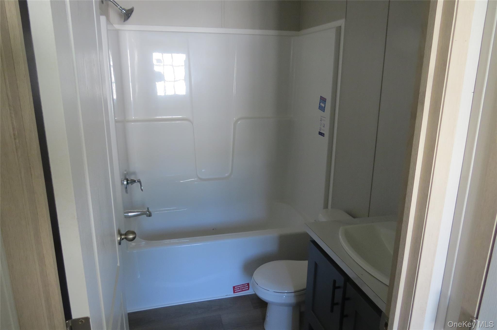 723 Beekman Road, Unit 35 Hopewell Junction, NY 12533 - Photo 10 of 16 a bathroom with a sink and toilet