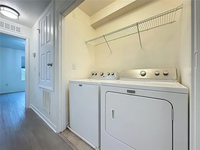 a utility room with dryer and washer