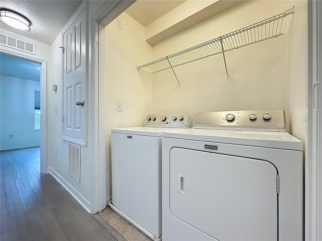 3135 Tocoa Circle Kissimmee, FL 34746 - Photo 21 of 36 a utility room with dryer and washer