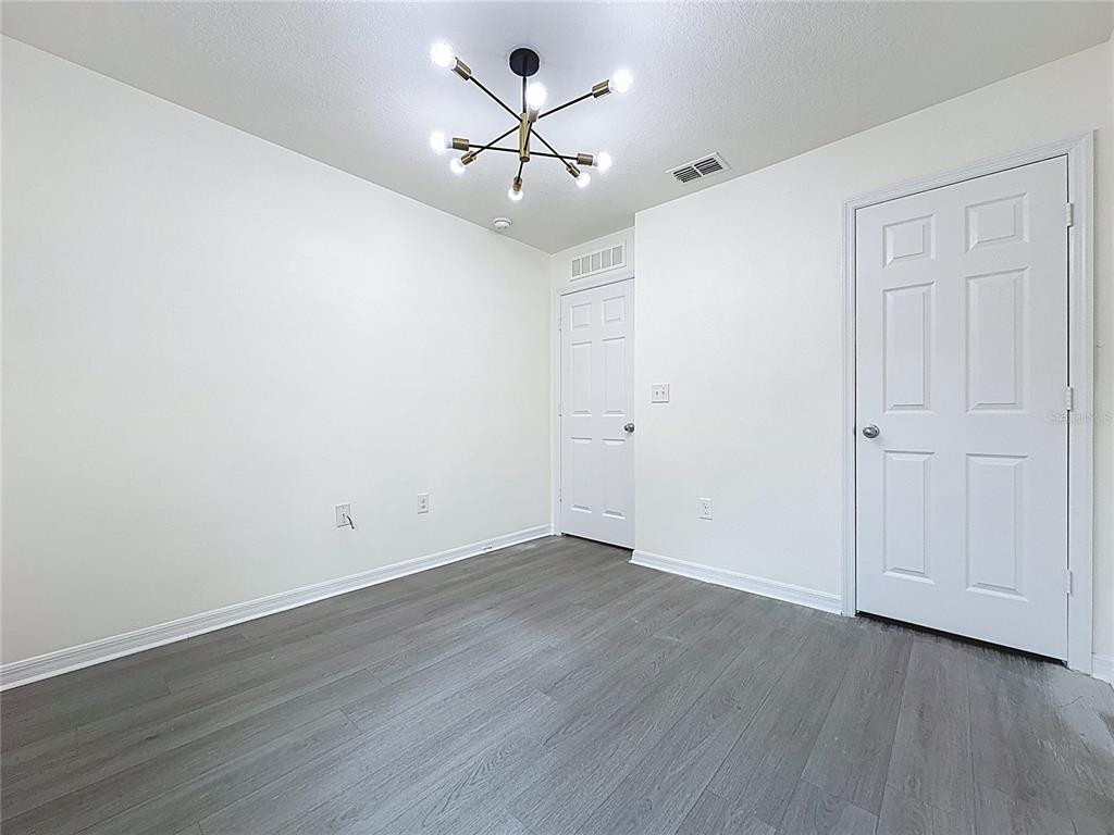 3135 Tocoa Circle Kissimmee, FL 34746 - Photo 23 of 36 wooden floor in an empty room