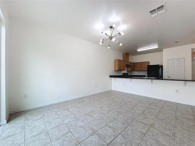 a view of a kitchen with a sink and cabinets