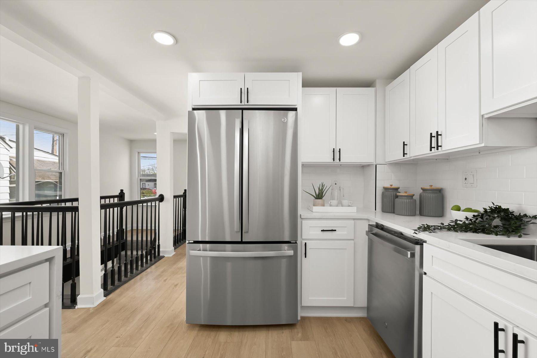 518 Church Street Baltimore, MD 21225 - Photo 12 of 27 a kitchen with stainless steel appliances a refrigerator sink and cabinets
