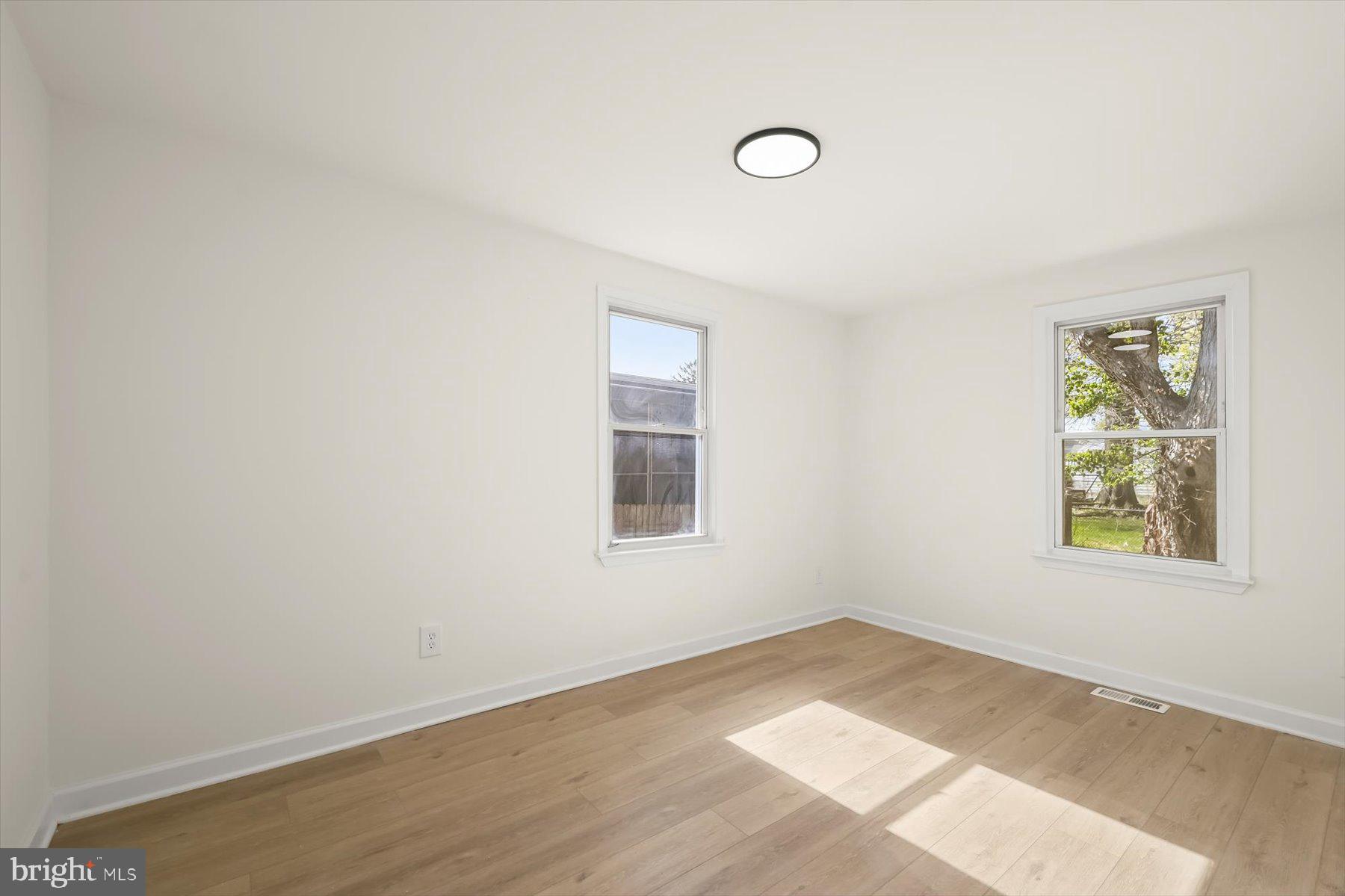 518 Church Street Baltimore, MD 21225 - Photo 13 of 27 an empty room with windows