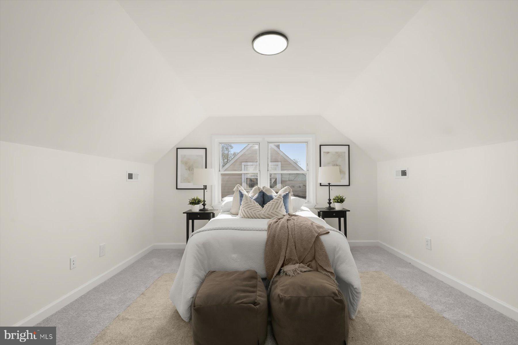 518 Church Street Baltimore, MD 21225 - Photo 17 of 27 a bed room with a bed and a chandelier