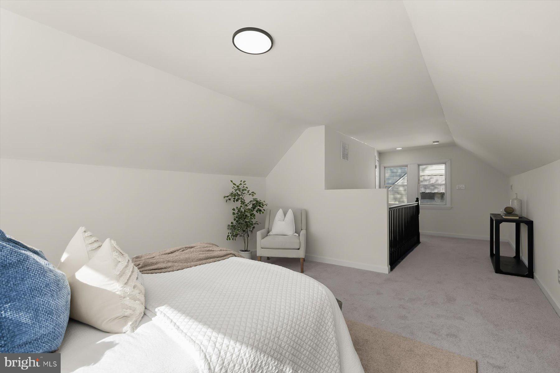 518 Church Street Baltimore, MD 21225 - Photo 19 of 27 a bedroom with a bed and a chandelier