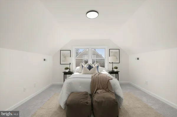 a bed room with a bed and a chandelier