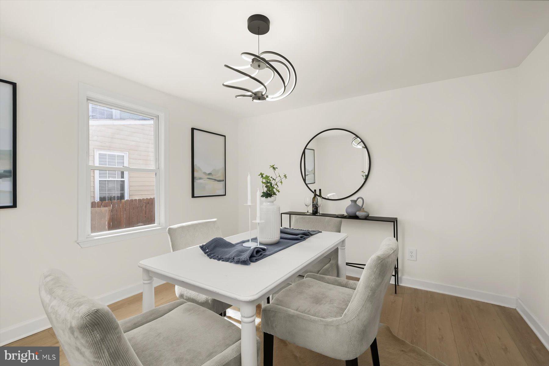 518 Church Street Baltimore, MD 21225 - Photo 6 of 27 a dining room with a table and chairs