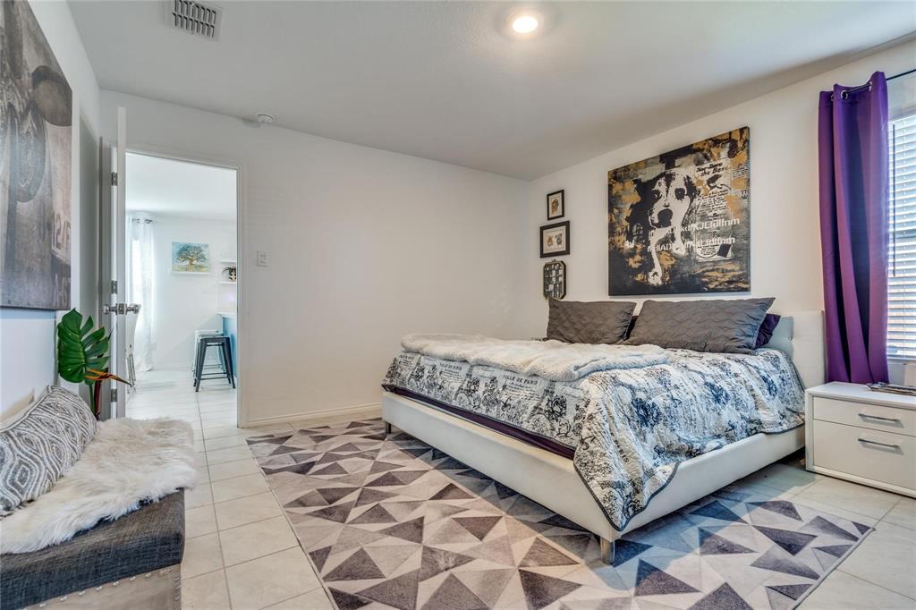 7733 Ruellia Road McKinney, TX 75071 - Photo 8 of 19 Bedroom featuring light tile patterned flooring