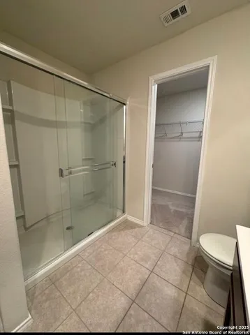 a bathroom with a sink toilet and mirror