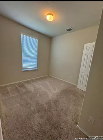 a kitchen with a sink and a stove top oven