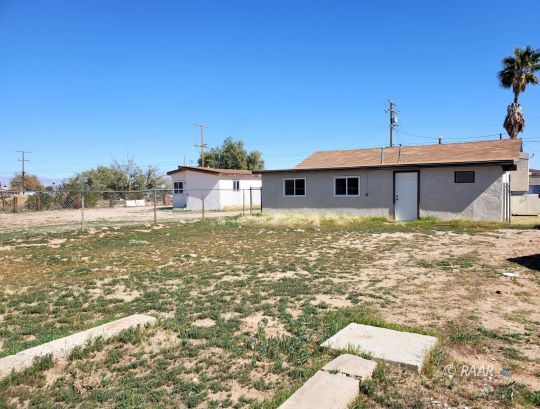 237 Sunset Place Ridgecrest, CA 93555 - Photo 17 of 17 a front view of a house with a yard