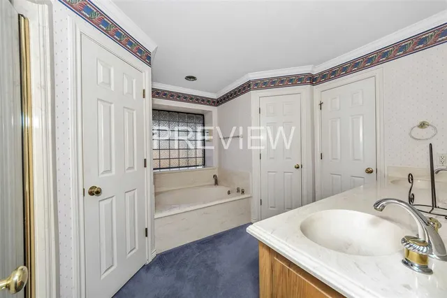 a bed room with a bed and a chair