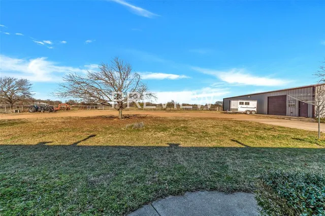 a view of house with yard