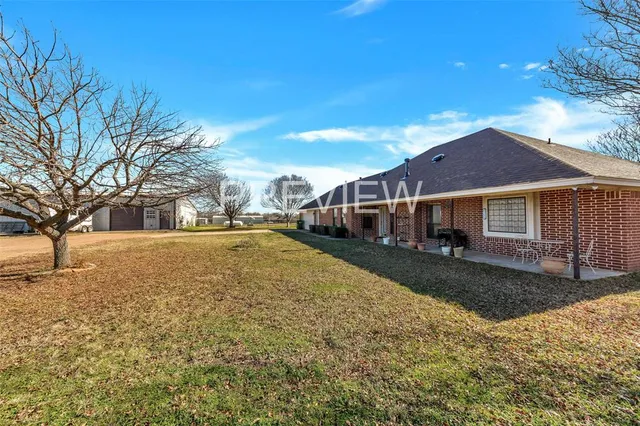 a view of a balcony with lake view and a potted plant