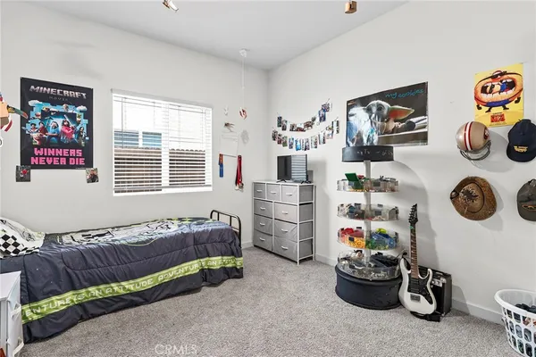 a bedroom with furniture and a window