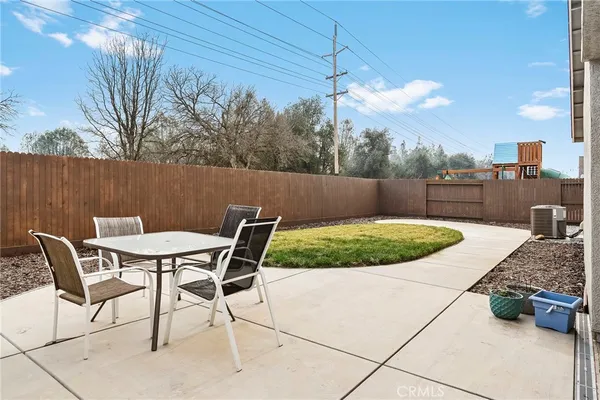 a view of a chairs and table in the patio