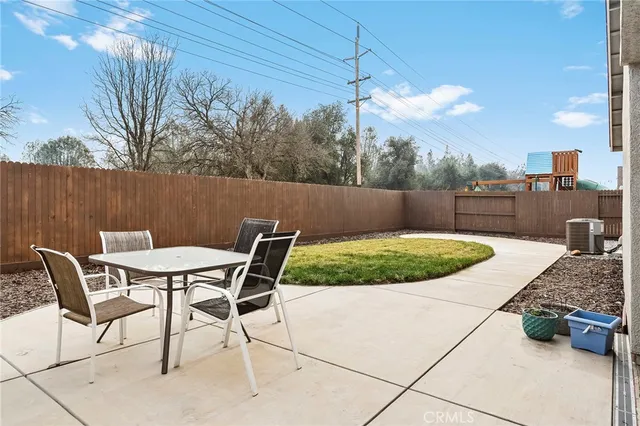 a view of a chairs and table in the patio