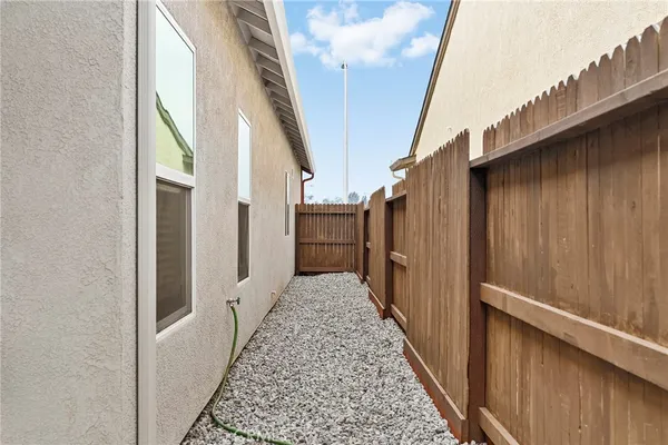 a view of a pathway of a house with wooden floor
