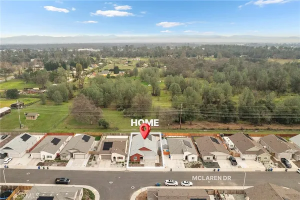 an aerial view of a house with a lake view