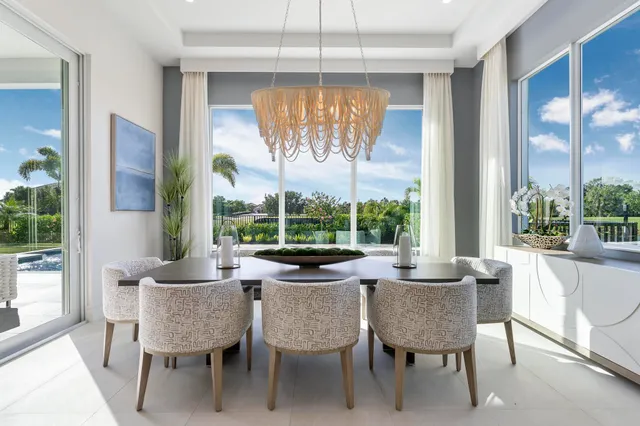 a living room with kitchen island furniture and a view of kitchen