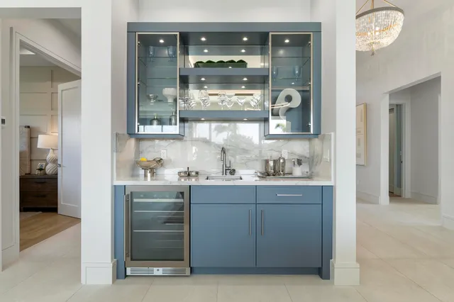 a spacious bedroom with a bed and a chandelier