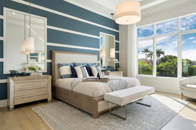 a large white bed in a white room