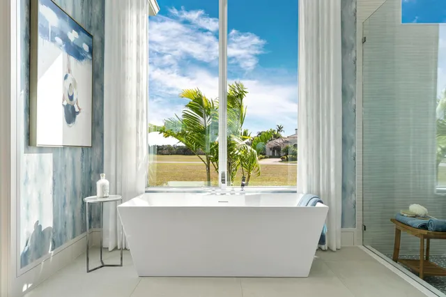 a bathroom with a double vanity sink and a window
