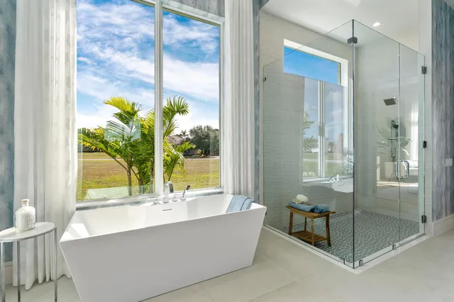 a bathroom with a tub and shower